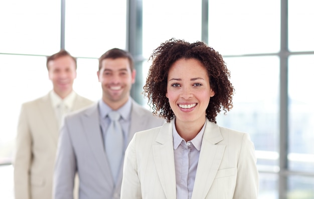 Smiling businesswoman leading her colleagues