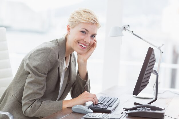 Smiling businesswoman looking at camera