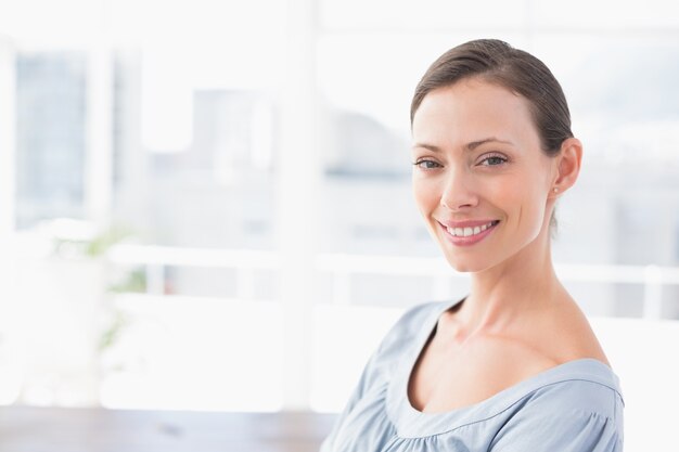 Smiling businesswoman looking at camera