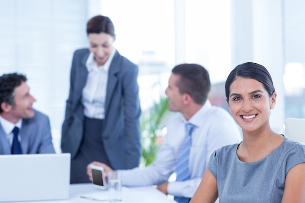 Smiling businesswoman looking at camera