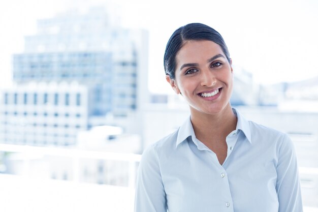 Smiling businesswoman looking at camera