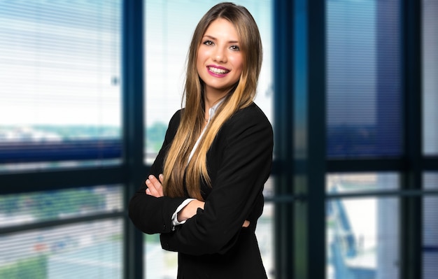 Smiling businesswoman portrait in a modern office