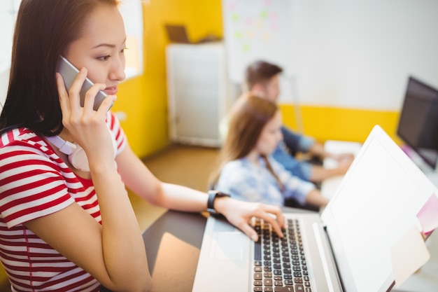 Smiling businesswoman talking on phone