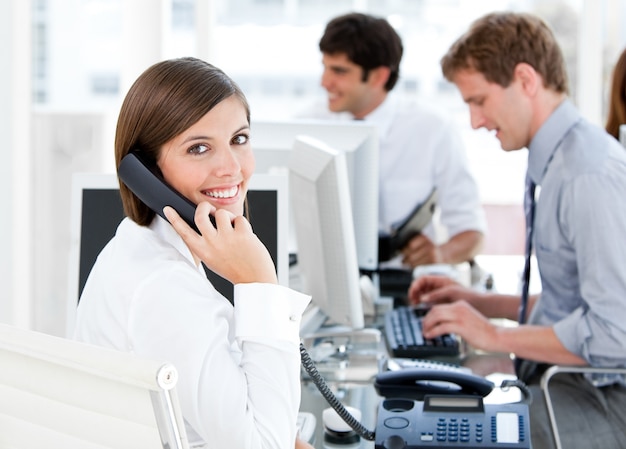 smiling businesswoman talking to the phone 