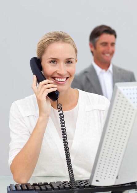 Smiling businesswoman talking on phone