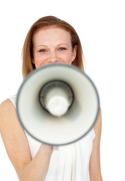 Smiling businesswoman using a megaphone