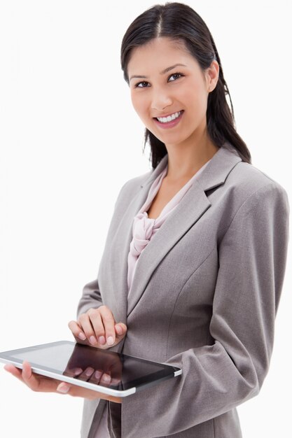 Smiling businesswoman using tablet