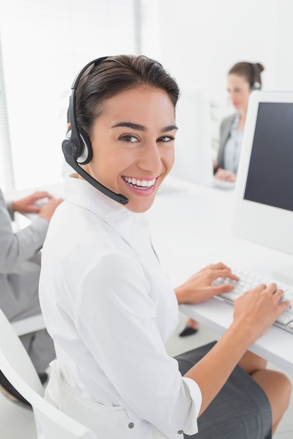 Smiling businesswoman wearing headset 