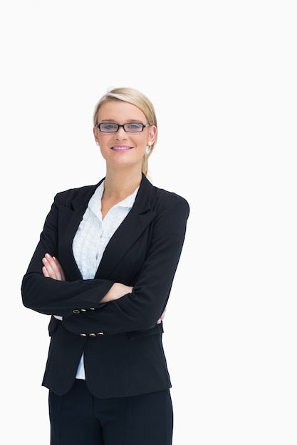 Smiling businesswoman with arms crossed