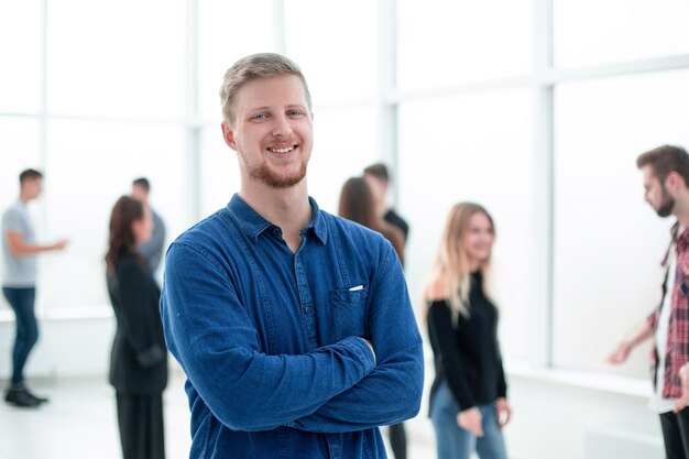 Smiling casual man standing in the office