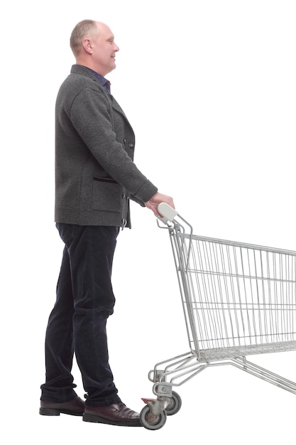 Smiling casual man with shopping cart isolated on a white background