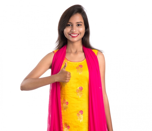 Smiling cheerful girl showing sign isolated on white background