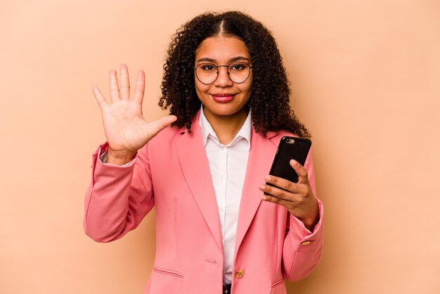 Smiling cheerful showing number five with fingers