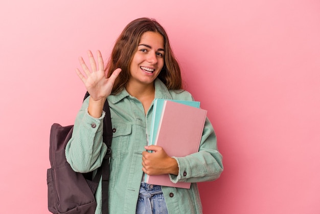 Smiling cheerful showing number five with fingers