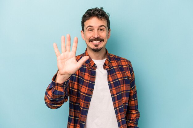 Smiling cheerful showing number five with fingers