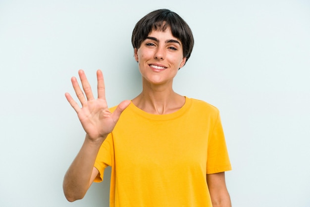 Smiling cheerful showing number five with fingers