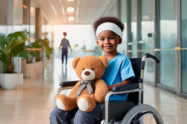 Smiling Child boy in hospital in wheelchair with teddy bear