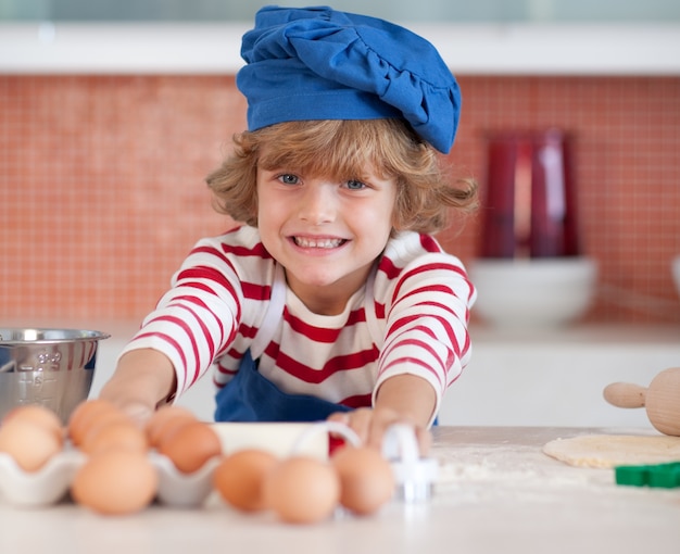 Smiling child with eggs 