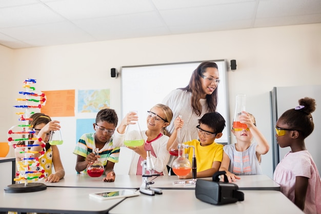 Photo smiling children doing science