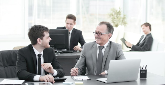 Smiling colleagues working with exchange in the office