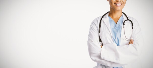 Smiling confident female doctor with crossed arms