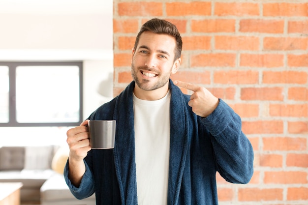 smiling confidently pointing to own broad smile, positive, relaxed, satisfied attitude