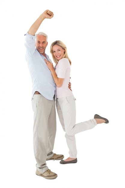 Smiling couple cheering at the camera