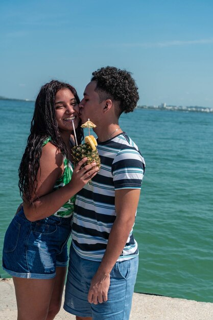 Smiling couple embracing at the beach