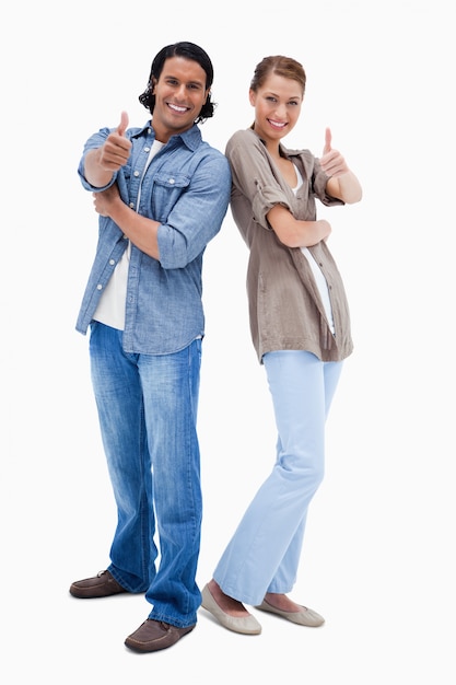 Photo smiling couple giving thumbs up
