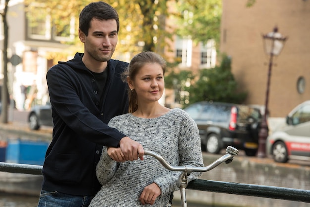 smiling couple looking away in city