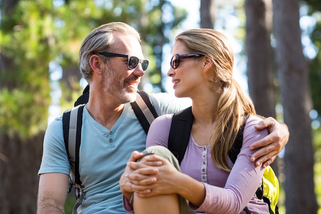 Smiling couple looking face to face while relaxing