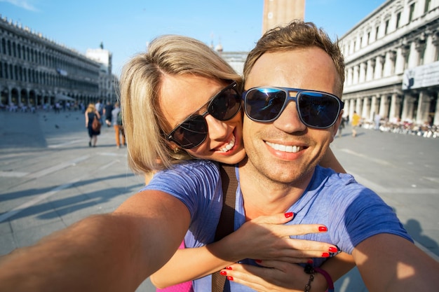 Smiling couple making selfie photo