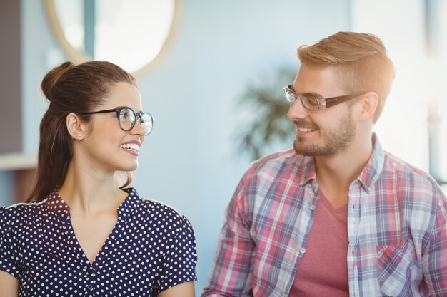 Smiling couple wearing spectacles