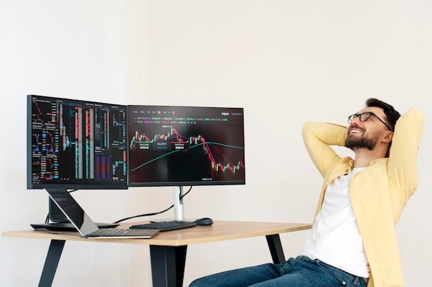 Smiling crypto trader leaning back relaxing at workplace Successful business online trading