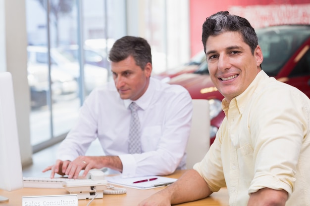 Smiling customer looking at camera