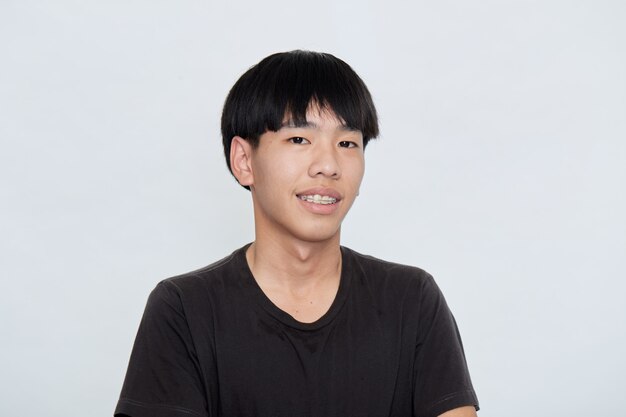 Smiling cute Asian man in a black t-shirt