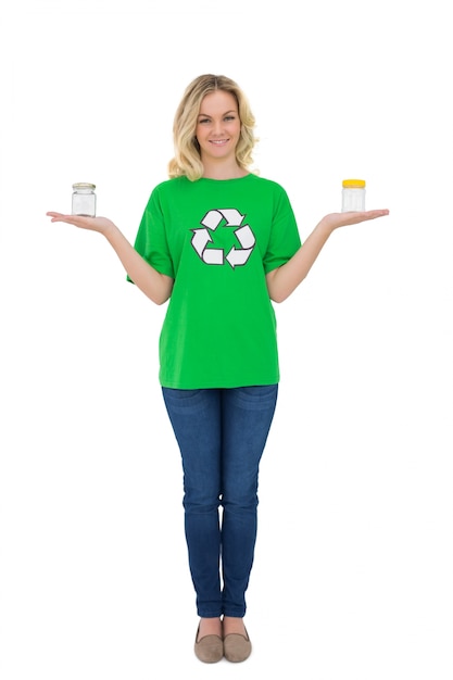 Smiling cute environmental activist holding glass jars