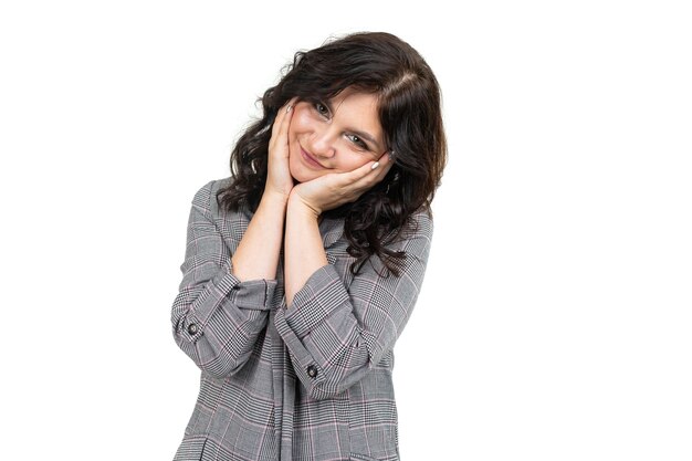 Smiling cute girl in a classic plaid jacket on a white background.