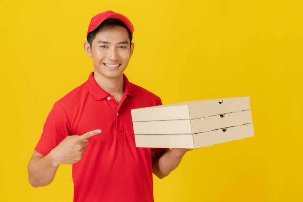 Smiling delivery man employee in red cap blank t-shirt uniform