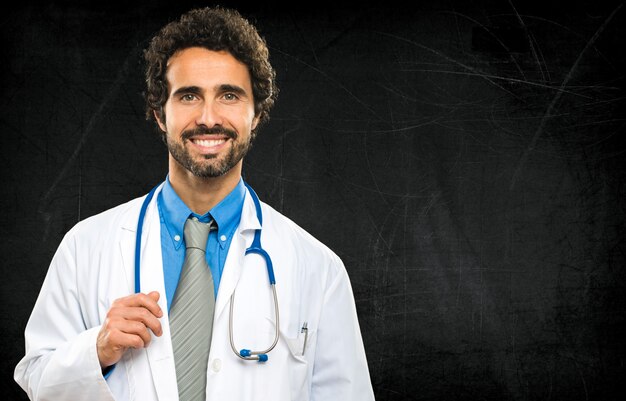 Smiling doctor on a chalkboard 