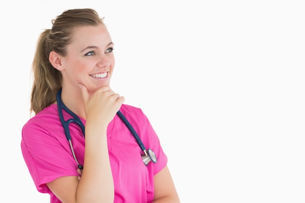 Smiling doctor looking thoughtful