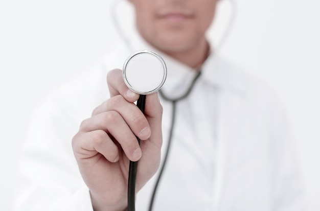 Smiling doctor showing stethoscope