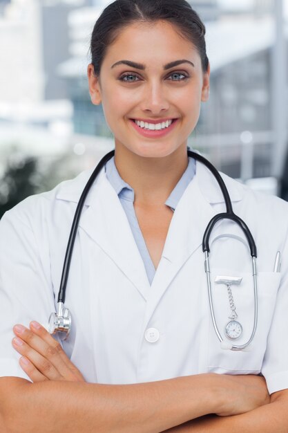 Smiling doctor with arms crossed