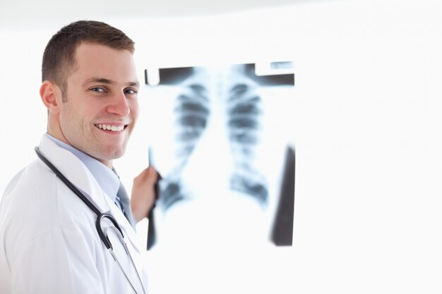 Smiling doctor with x-ray