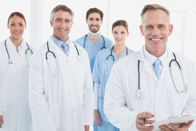 Smiling doctors all standing together