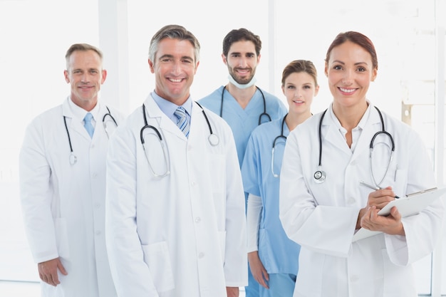 Smiling doctors all standing together