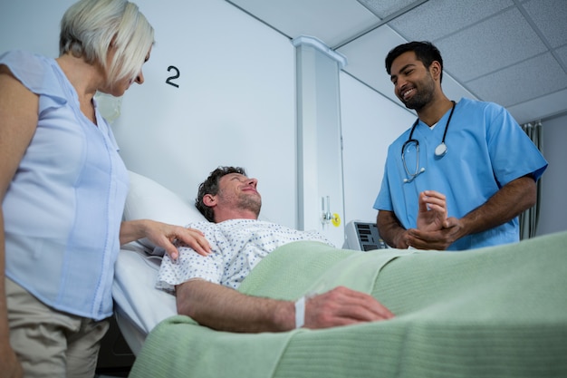 Smiling doctors interacting with each other