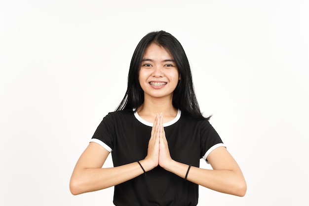 Smiling and doing namaste greeting of Beautiful Asian Woman Isolated On White Background