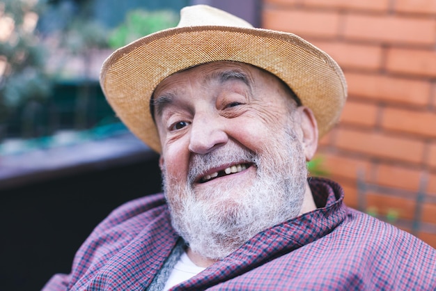 Smiling elderly man with missing tooth