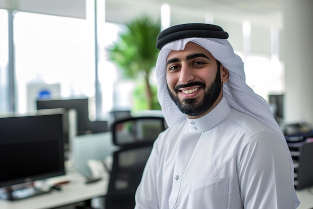 Smiling emirati arab at office wearing kandura